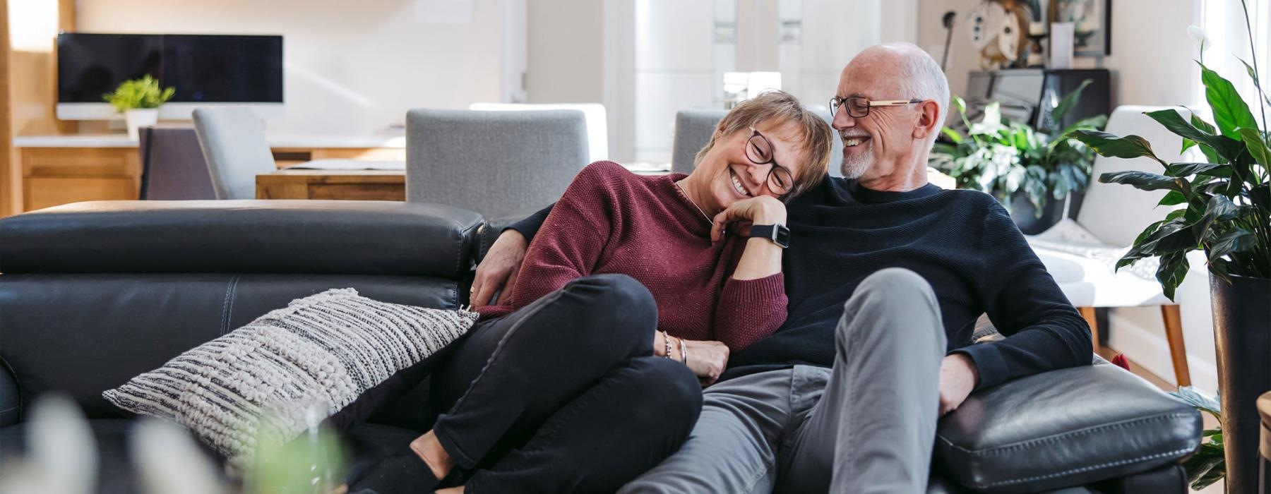 a man and woman sitting on a couch