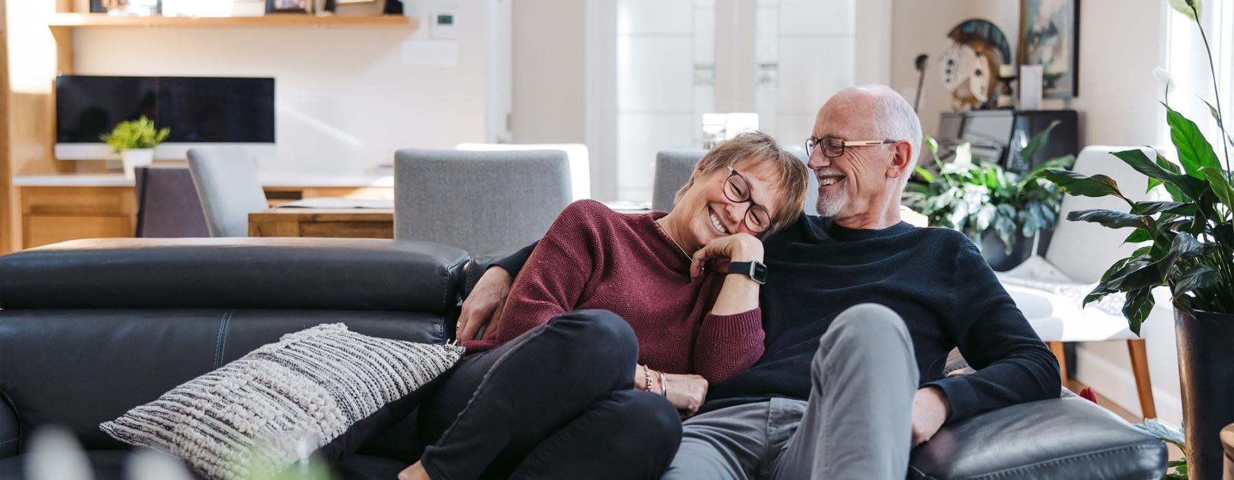 a man and woman sitting on a couch